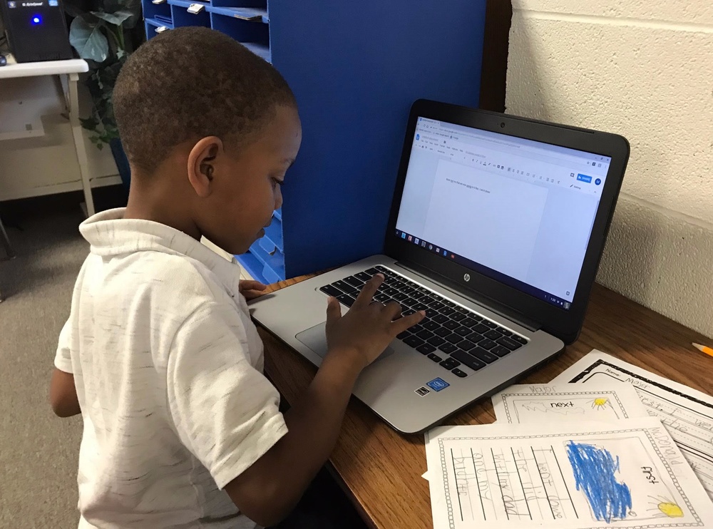 Major McDonald works on a Chromebook to publish his first personal narrative!